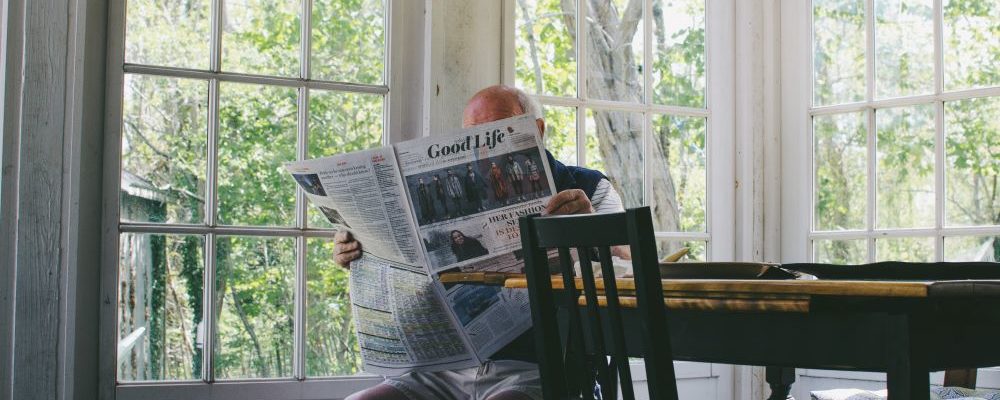 man reading a newspaper