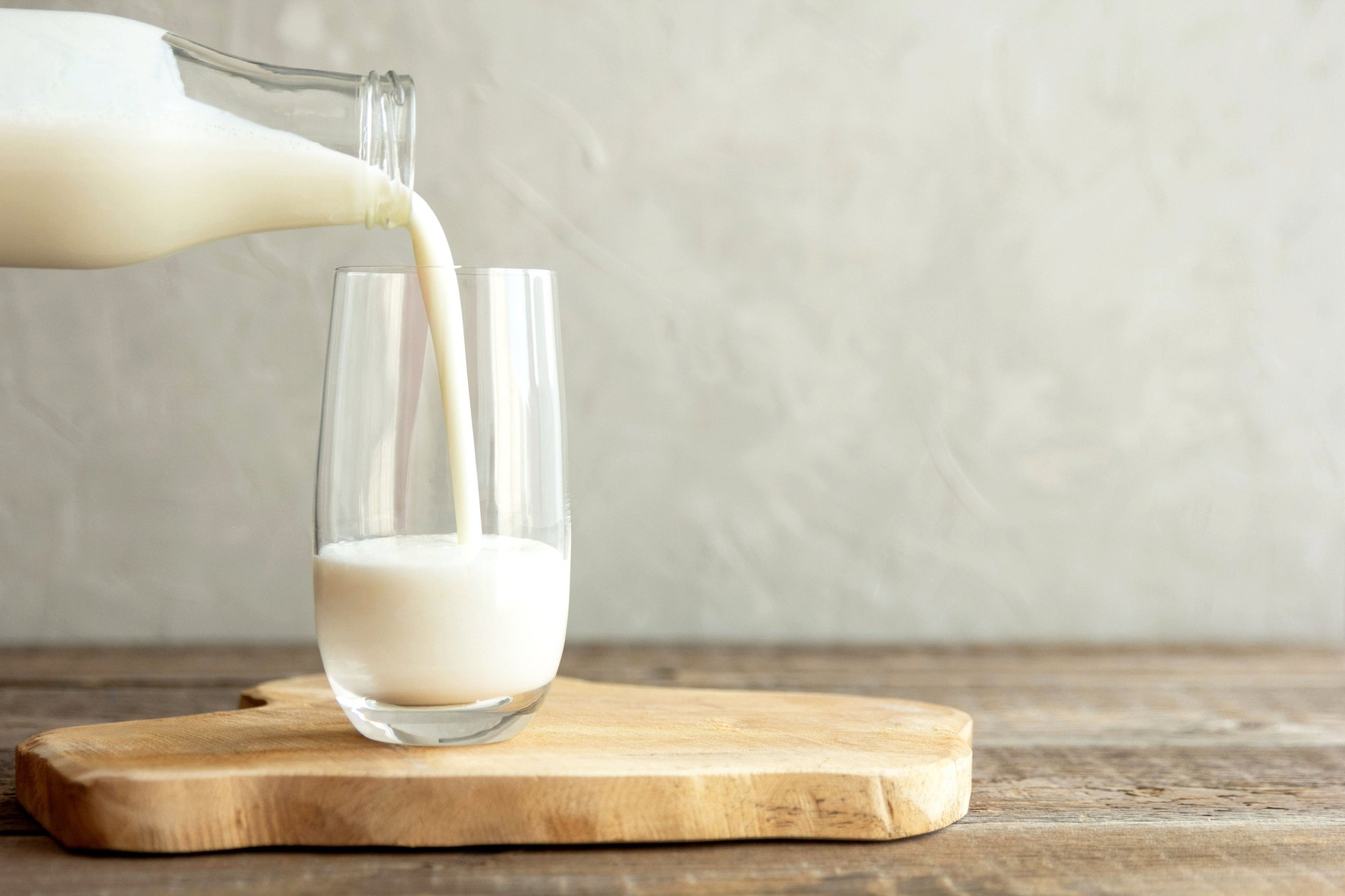 Does lack of calcium cause osteoporosis? A jug of milk is being poured into a glass. Including dairy in your diet is a great way to get plenty of calcium.