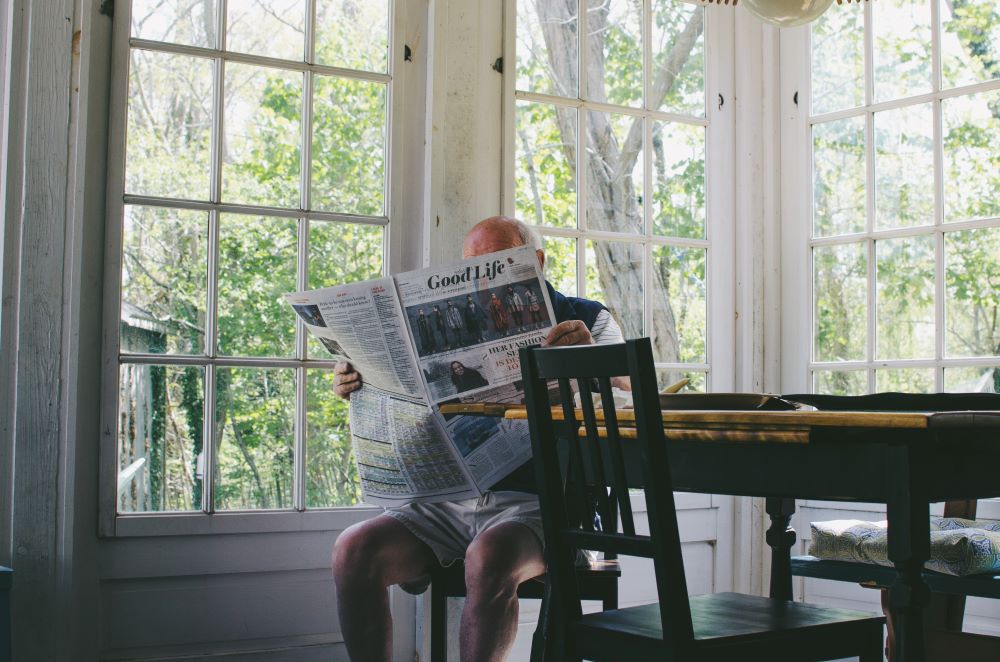 man reading a newspaper