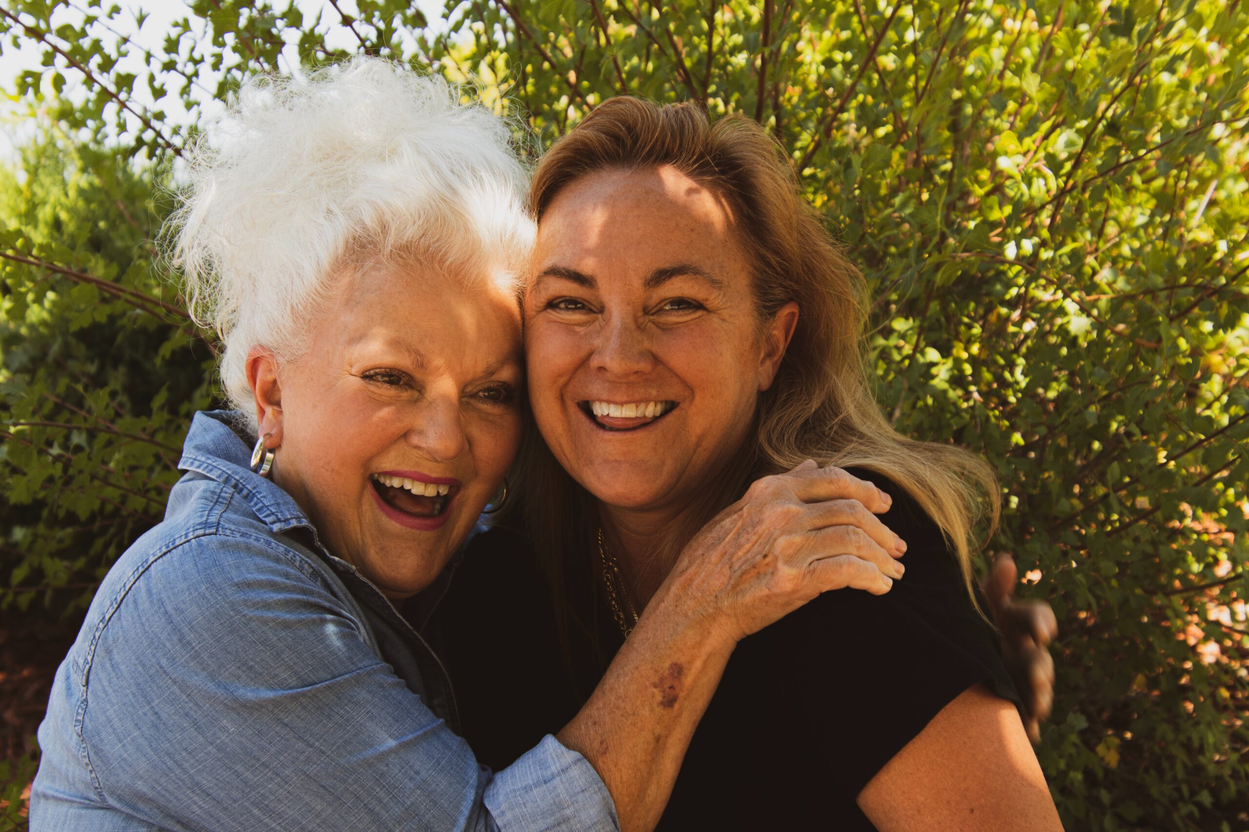 elderly mother and daughter hugging