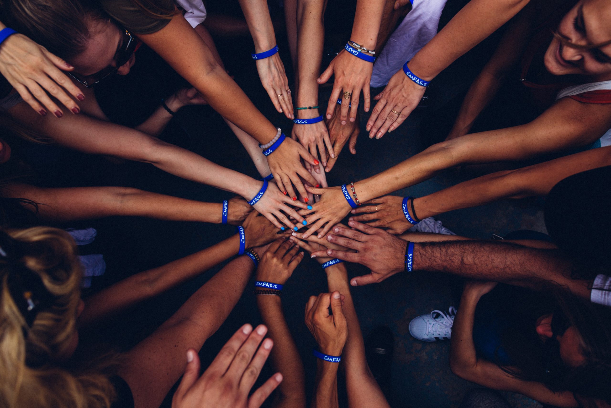 group of people holding hands
