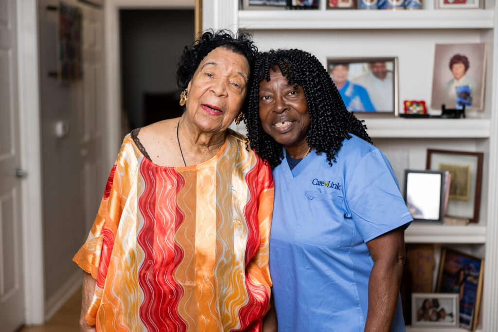 an elderly woman with her caregiver