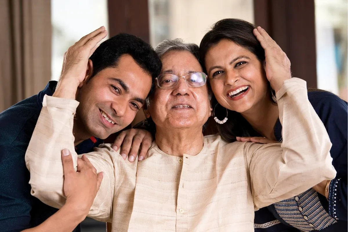 Family caregiver having a conversation with elderly parent about accepting help and support